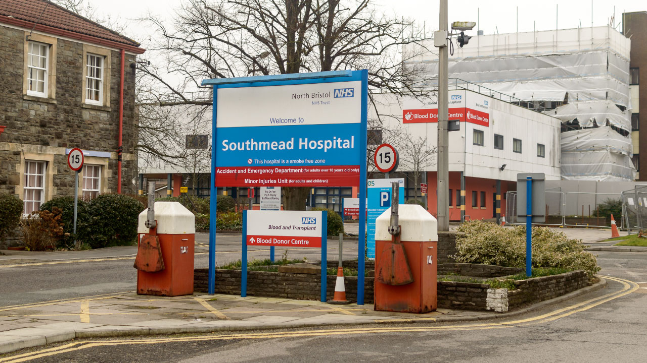 A Southmead Hospital sign with buildings in the background