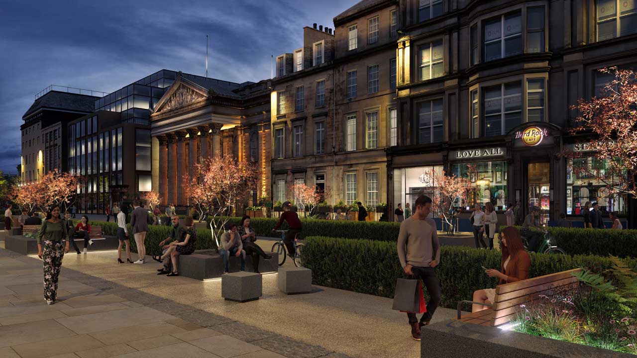 Night view of pedestrian walkway lined with businesses, greenery, and recessed lighting