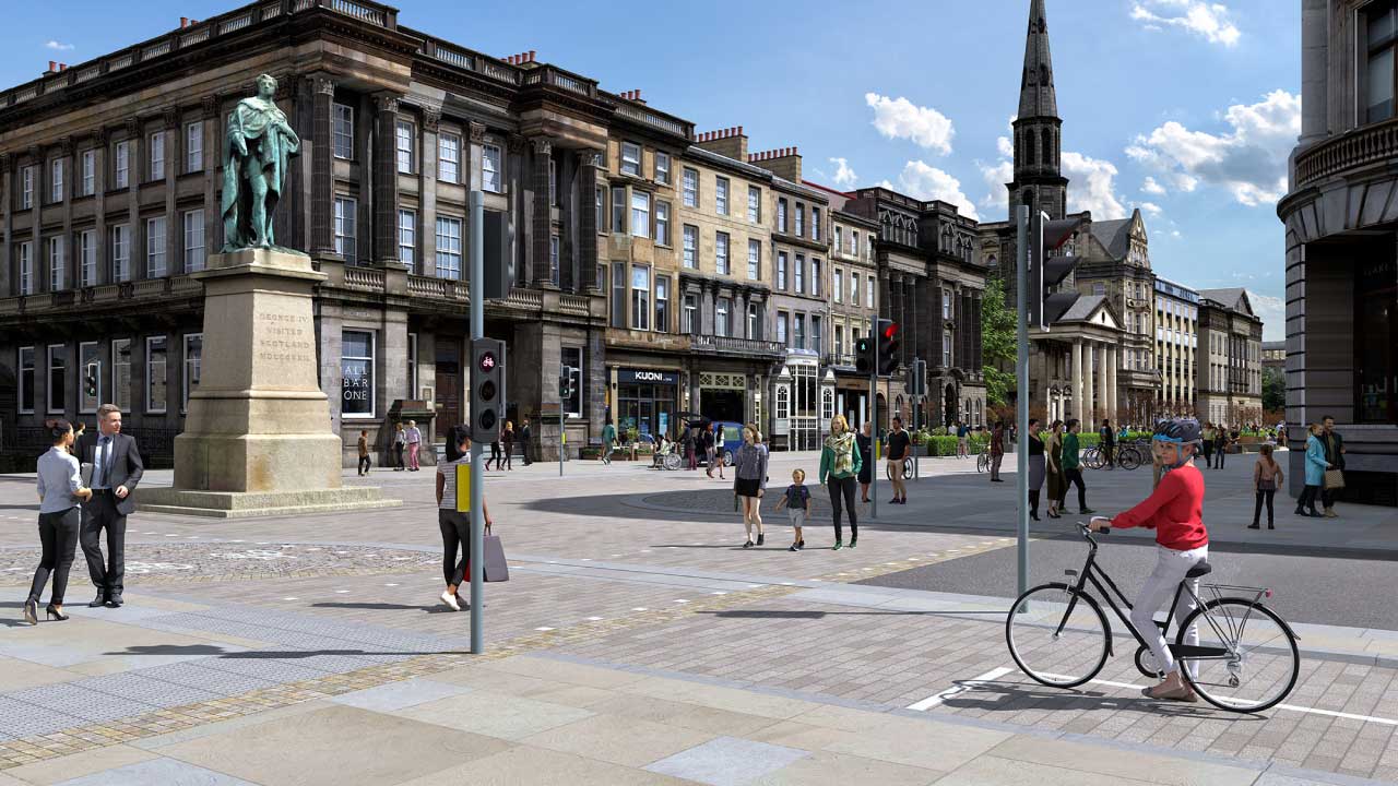 People walking and biking at intersection on pedestrian-friendly street