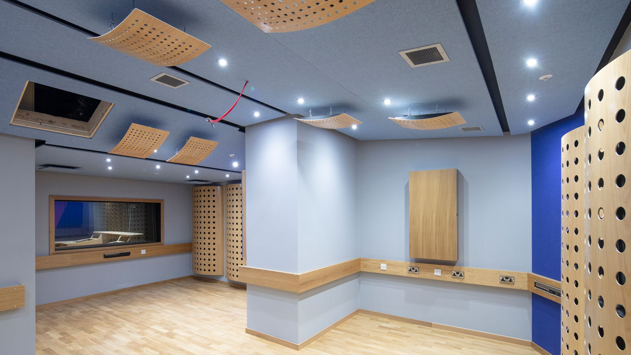 Interior of a college building featuring modern wooden panels on the walls