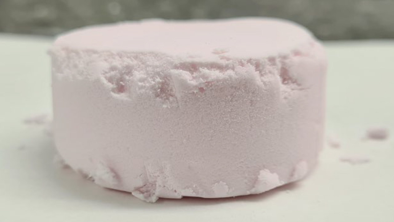 A light pink disk of high purity manganese