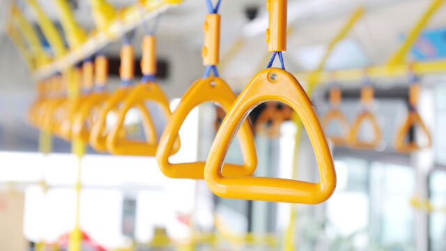 Yellow rungs for people to hold onto on public transportation