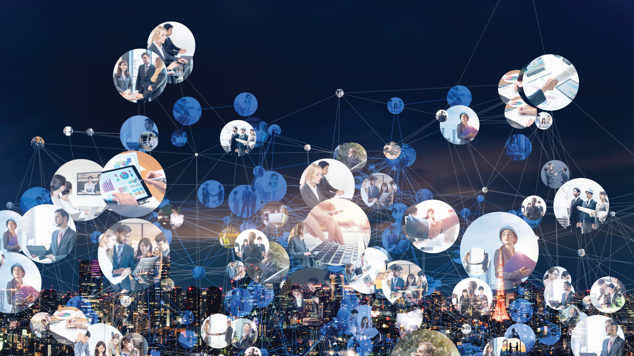 Multiple images of people working, meeting, or typing within connected circles overlaying city skyline at night