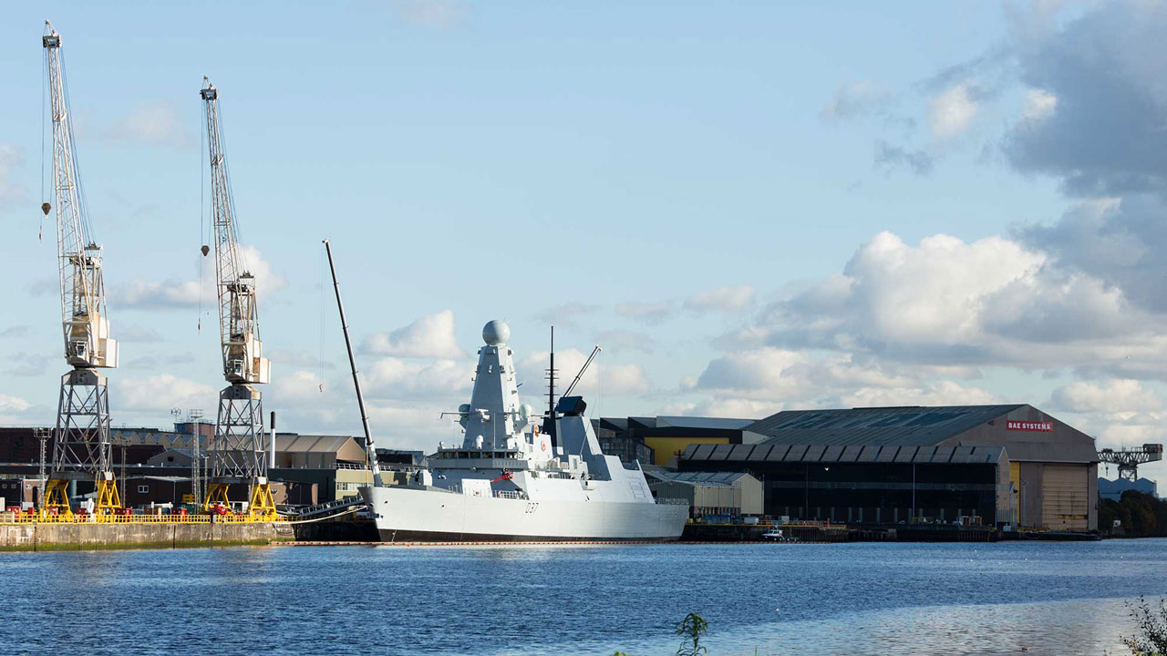 Royal naval ship docked next to the royal naval base