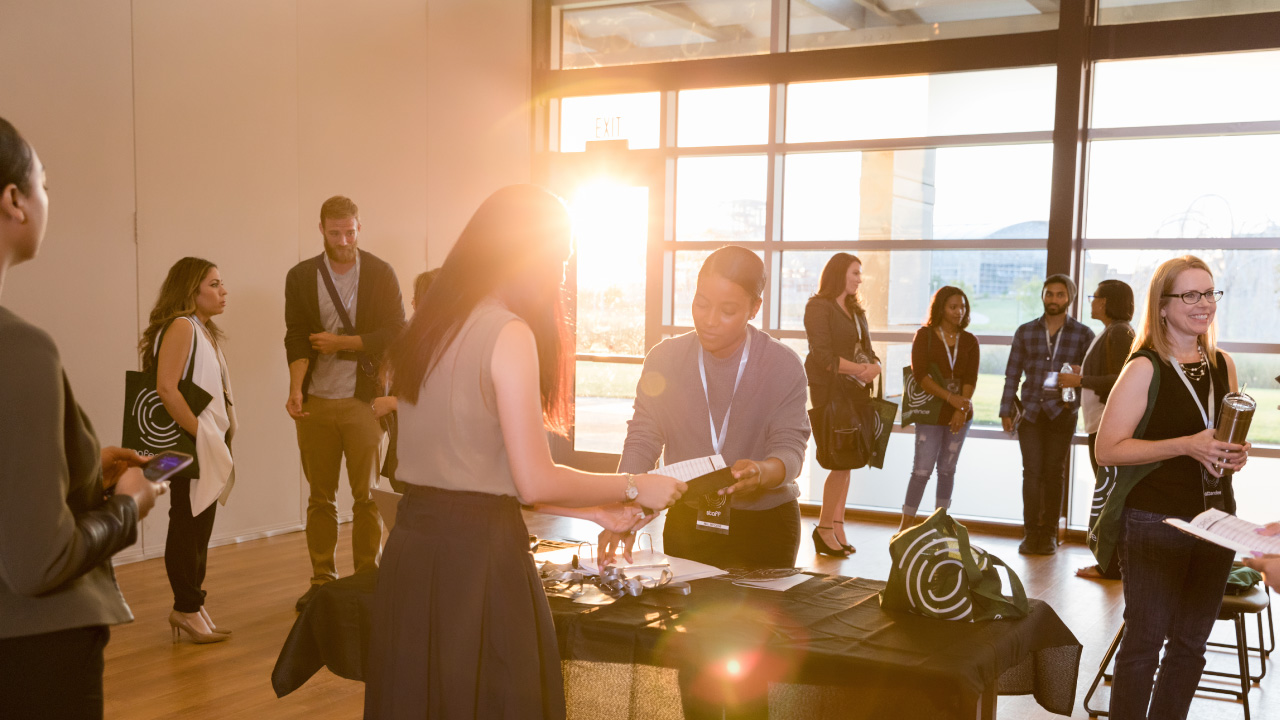 A group of employees gathered in a sunlit room