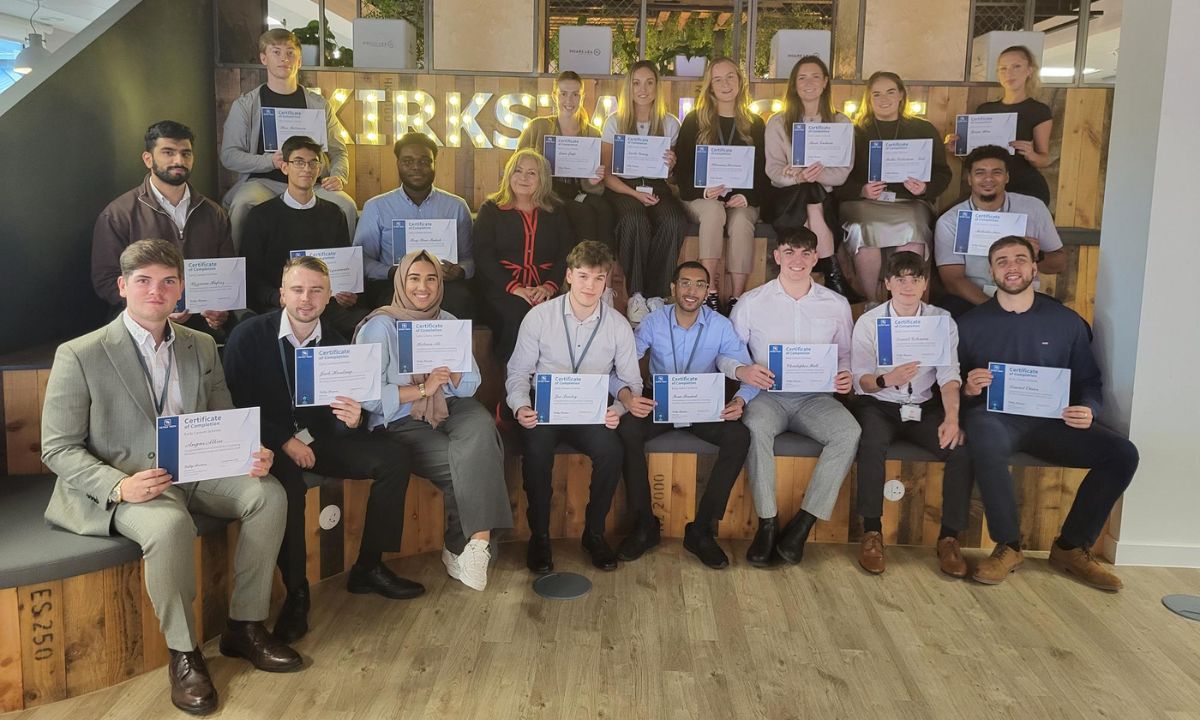 Tetra Tech Early Careers Graduates sat together with their certificates.